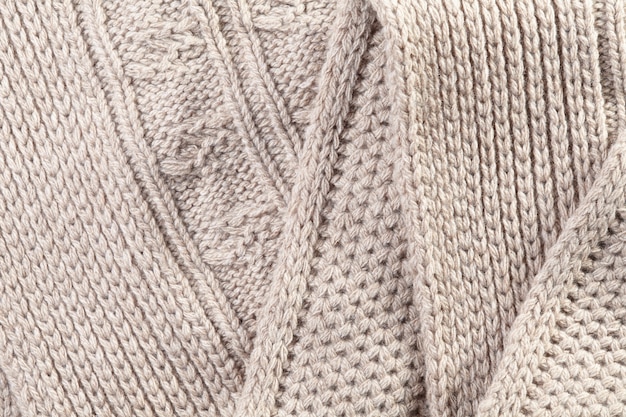 Handgemaakte beige gebreide achtergrond en textuur met plooien