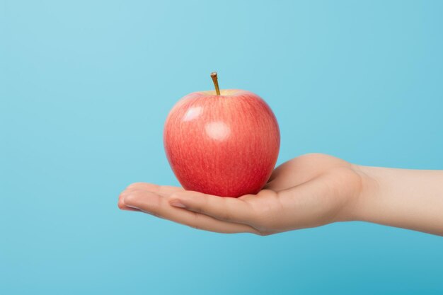 Handheld sweetness a hand presenting a luscious red apple a handheld ode to the sweetness of nature