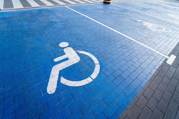 Handicapped symbol painted on a special parking space for disabled people