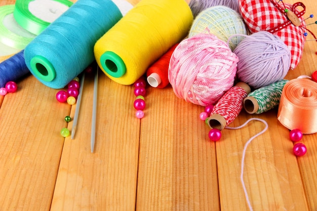 Handicraft supplies on wooden table closeup