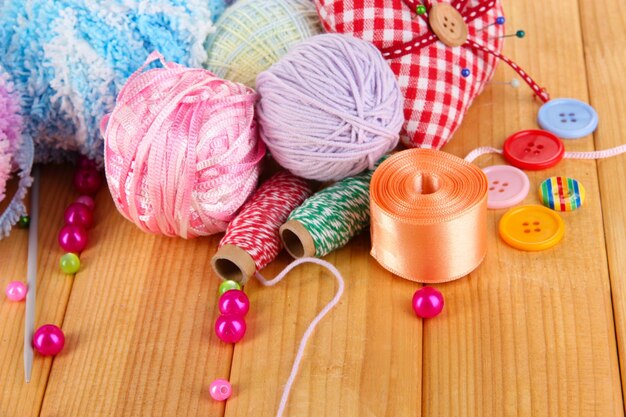 Handicraft supplies on wooden table closeup