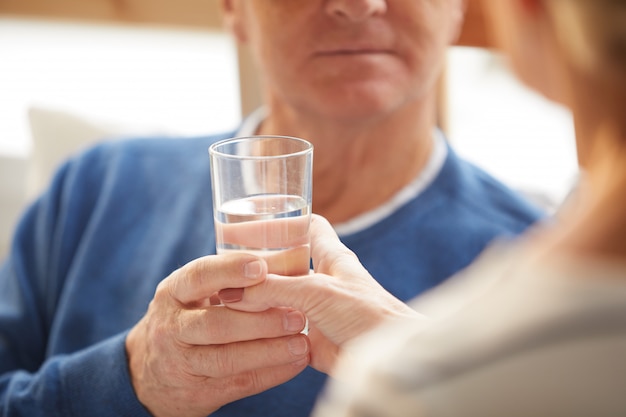 Handing Glass of Water