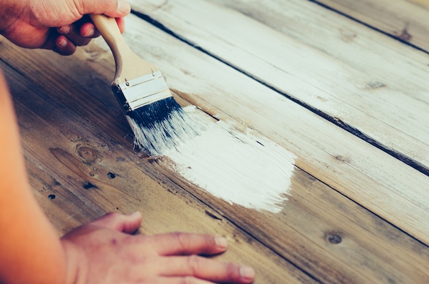 Handle brush painted white wood. 