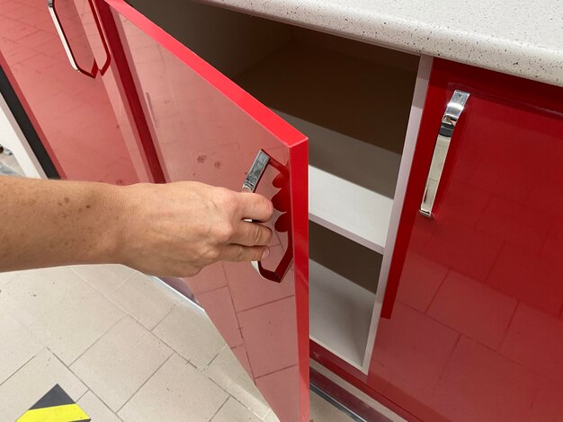 Handle of drawer with her hand