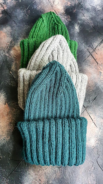 Handmade balaclava with ukrainian symbols knitted from gray and\
green threads warms reliably saves from the cold