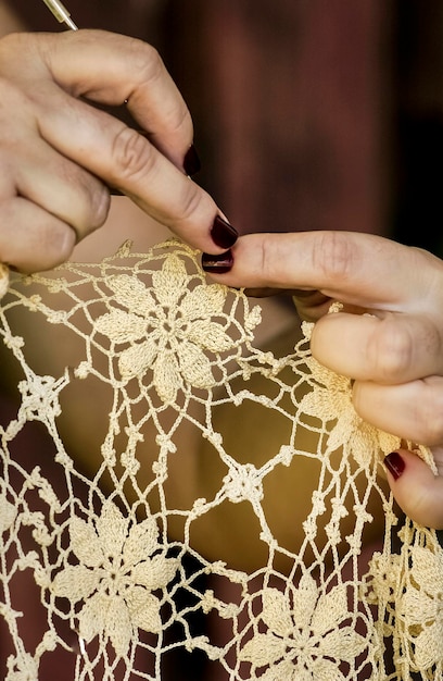 Handmade Brazilian lace crochet Closeup artisan hands crocheting