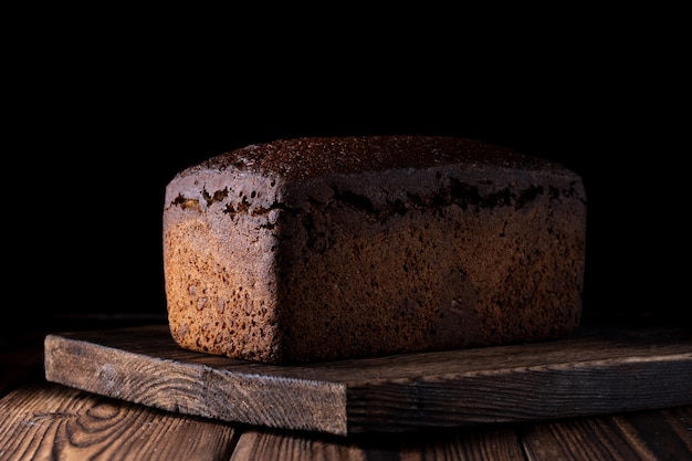 Handmade bread over a wood with black background