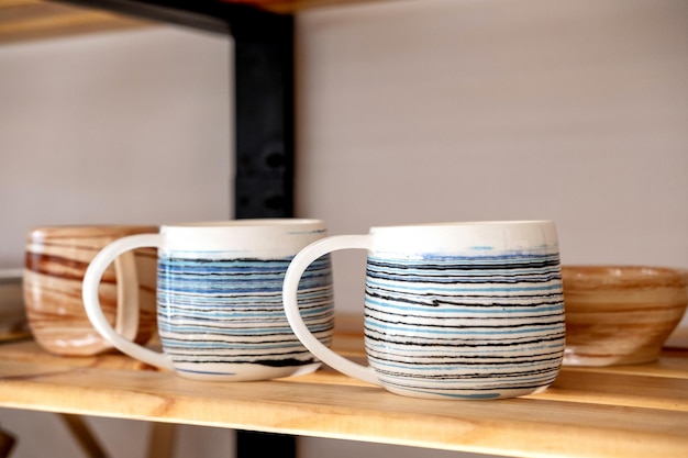 Handmade Ceramic Pottery Rack with ceramic dishes in creative studio potter