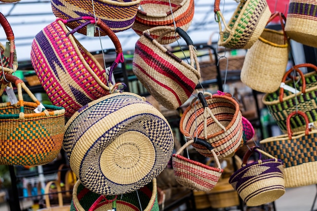 Handmade colorful baskets hanged for display.