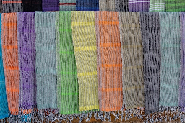 Handmade colorful Burmese fabric for sell in a tourist stall on the street market near Inle Lake in Burma Myanmar