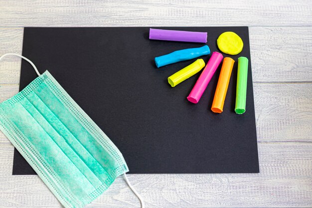 Handmade crafts. Creative activities for children. Black paper and neon plasticine. Children's creativity.