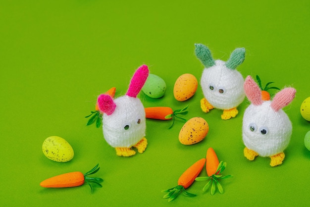 Handmade Easter concept Knitted bunnies with traditional decora