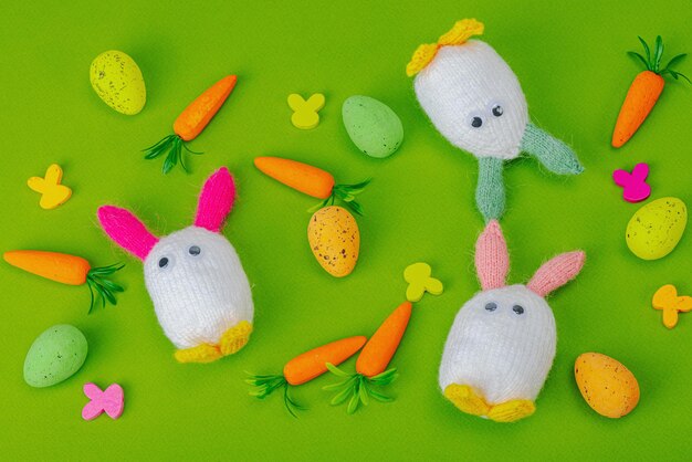 Handmade Easter concept Knitted bunnies with traditional decora