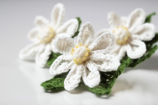 A handmade flower headband with a green leaf on it.