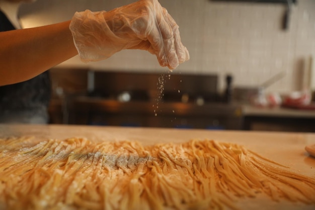 handmade fresh pasta making process. close up