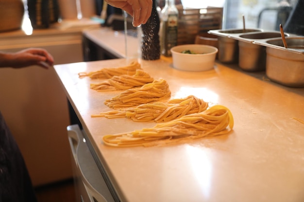 handmade fresh pasta making process. close up