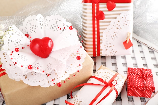 Handmade gifts on Valentine Day, on fabric background