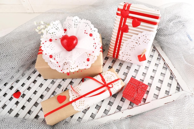 Handmade gifts on Valentine Day, on fabric background