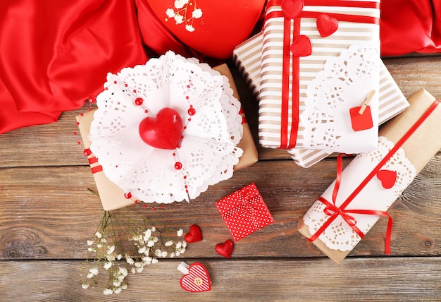 Handmade gifts on Valentine Day, on wooden background