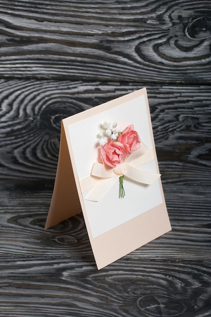 Photo handmade greeting card lies on pine boards