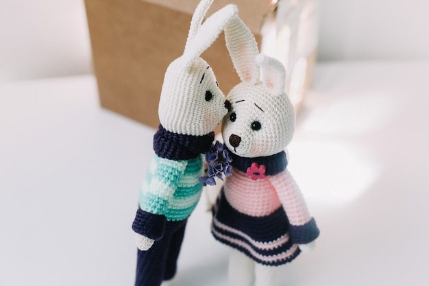 Photo handmade knitted toy rabbits