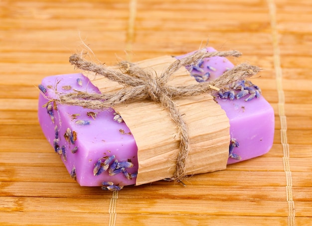 Handmade lavender soap on wooden mat