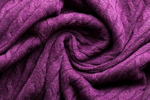 Handmade lilac knitting wool texture background