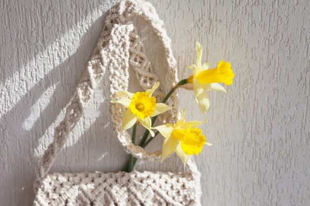 Handmade macrame bag  on the light wall