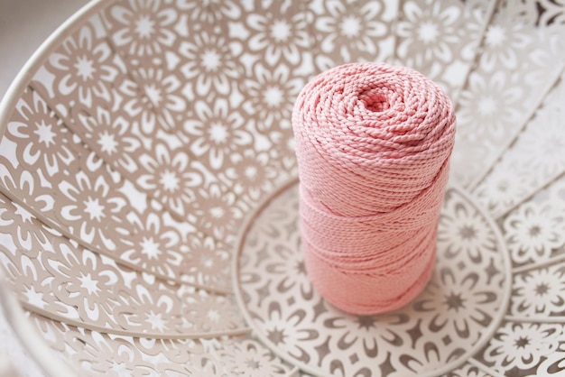 Handmade macrame braiding and cotton threads in white basket Cotton macrame cords and ropes