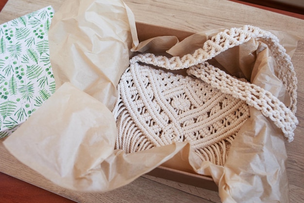 Handmade macrame cotton srossbody bag in the box Eco bag for women from cotton rope Scandinavian style bag Beige tones color sustainable fashion accessories Details Close up image