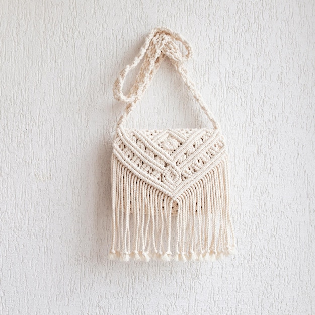 Handmade macrame cotton srossbody bag Eco bag for women from cotton rope Scandinavian style bag Creme tones sustainable fashion accessories Close up image