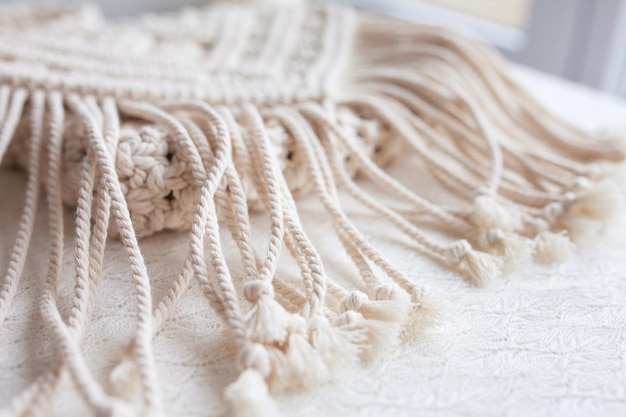 Handmade macrame cotton srossbody bag eco bag for women from\
cotton rope scandinavian style bag creme tones sustainable fashion\
accessories details close up image