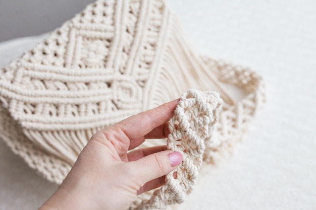 Handmade macrame cotton srossbody bag eco bag for women from\
cotton rope scandinavian style bag creme tones sustainable fashion\
accessories details close up image