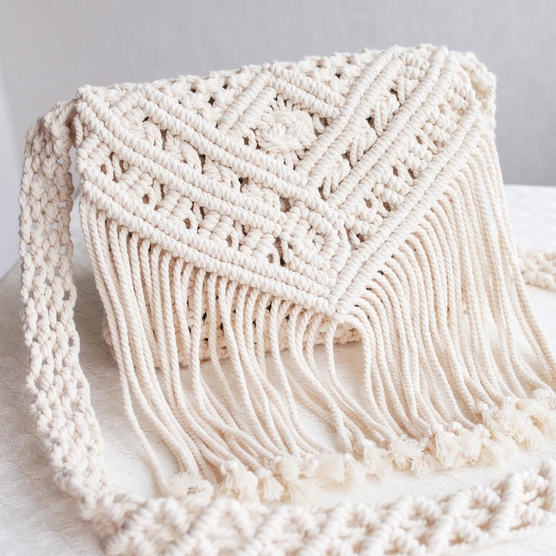 Handmade macrame cotton srossbody bag eco bag for women from\
cotton rope scandinavian style bag creme tones sustainable fashion\
accessories details close up image