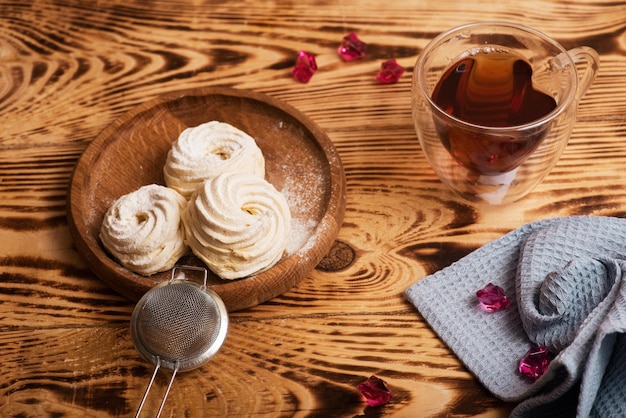 Handmade marshmallow Natural sweetness Apple zephir and cup of tea in wood surface