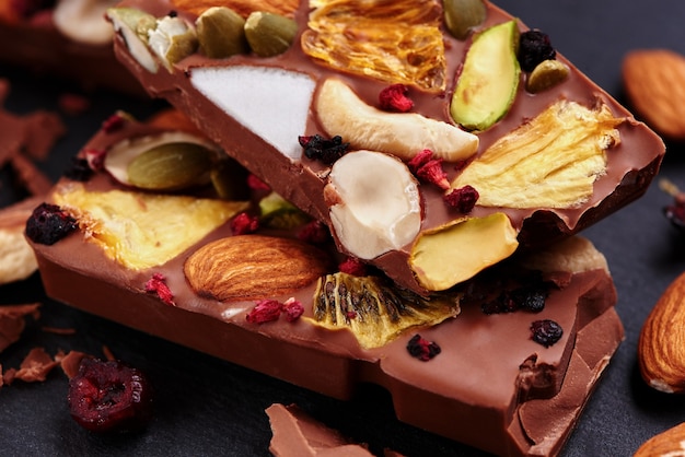 Handmade milk chocolate with dried fruits and nuts