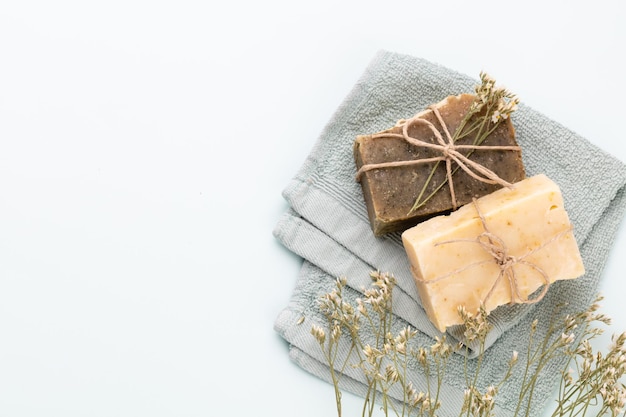 Handmade natural soap on pastel background.