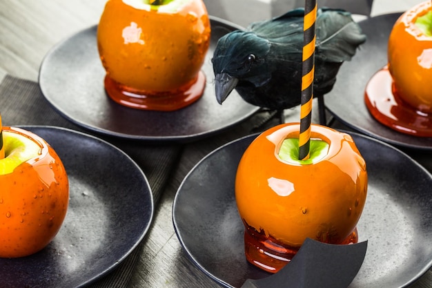 Handmade orange candy apples for Halloween.