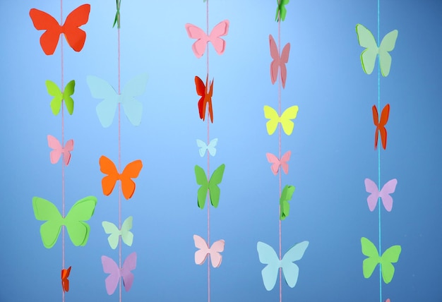 Photo handmade paper garland on blue background