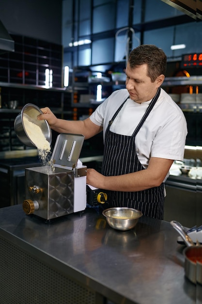 Handmade pasta preparation process at professional restaurant kitchen