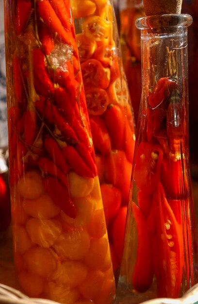 Handmade pepper in glass bottles for sale at a popular fair in Brazil