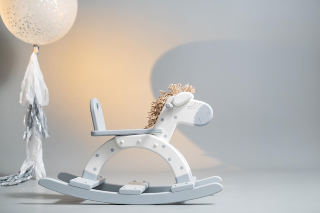 Handmade rocking horse on a gray background