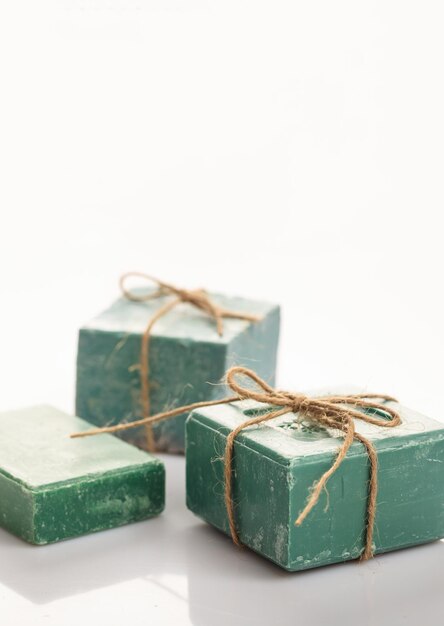 Handmade soap bars on white background Vertical copy space