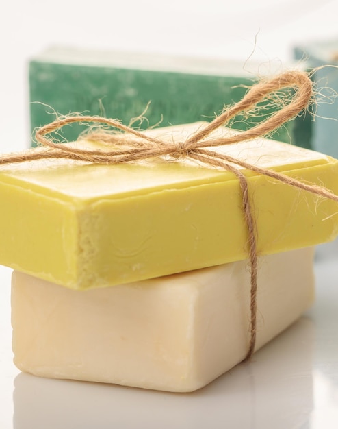 Handmade soap bars on white background Vertical