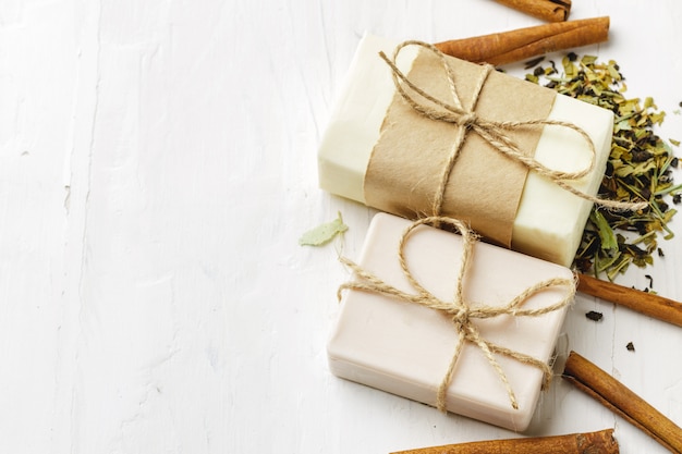 Handmade soap with cinnamon on the table, close up