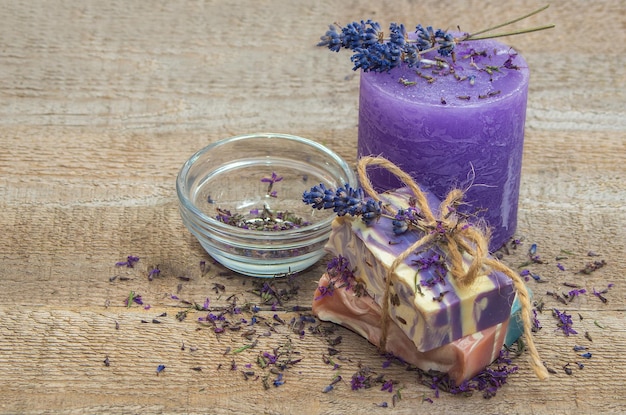 Handmade soap with lavender and purple natural aroma of lavender flowers on a wooden background