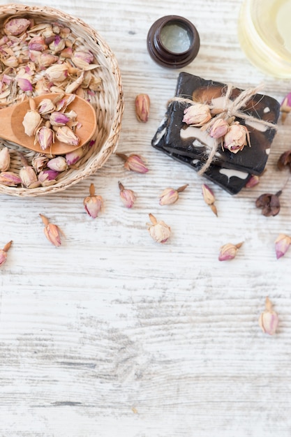 Handmade soap with roses on white