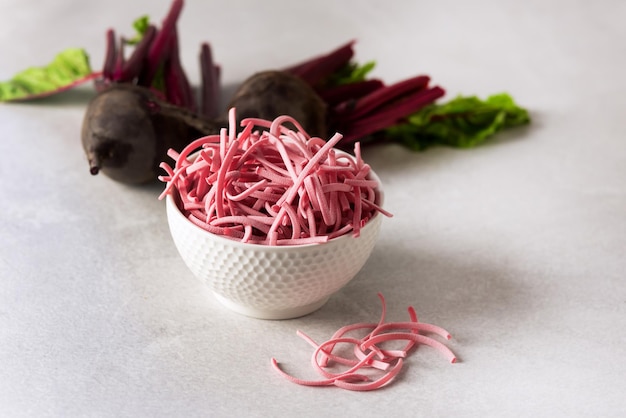 Handmade Turkish Noodles with Beetroot Pink Noodle Healthy Vegan Noodle Gray Background Horizontal