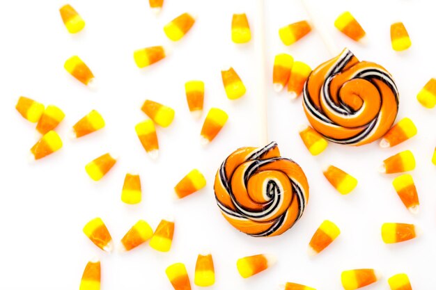 Photo handmade twist lollipop with orange and black stripes.