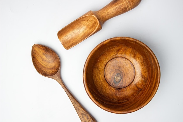 Handmade wooden spoon and bowl top view